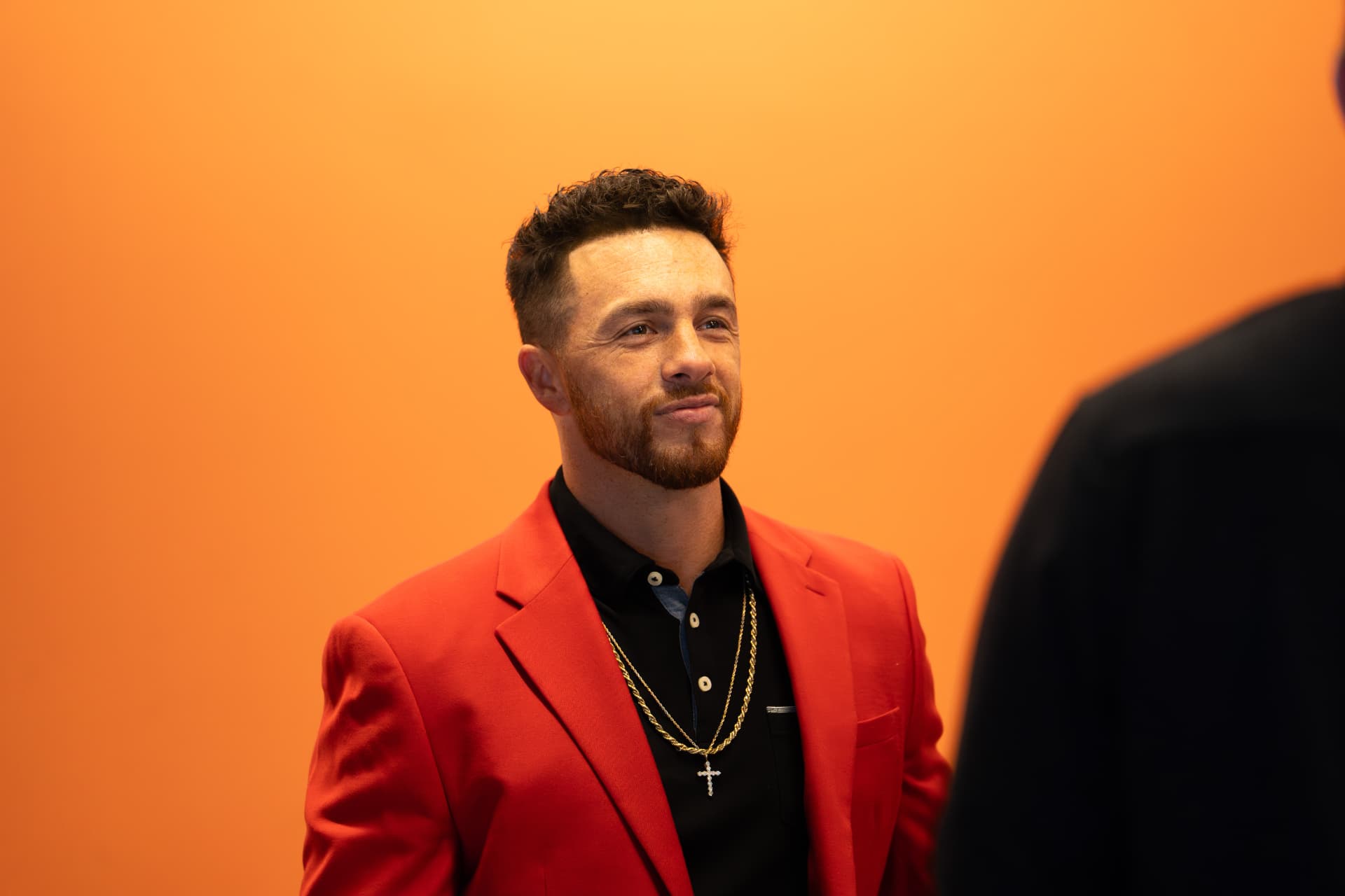 Rudy Perez Jr. in a red blazer at the October 2025 Vantage Business Mastery Workshop